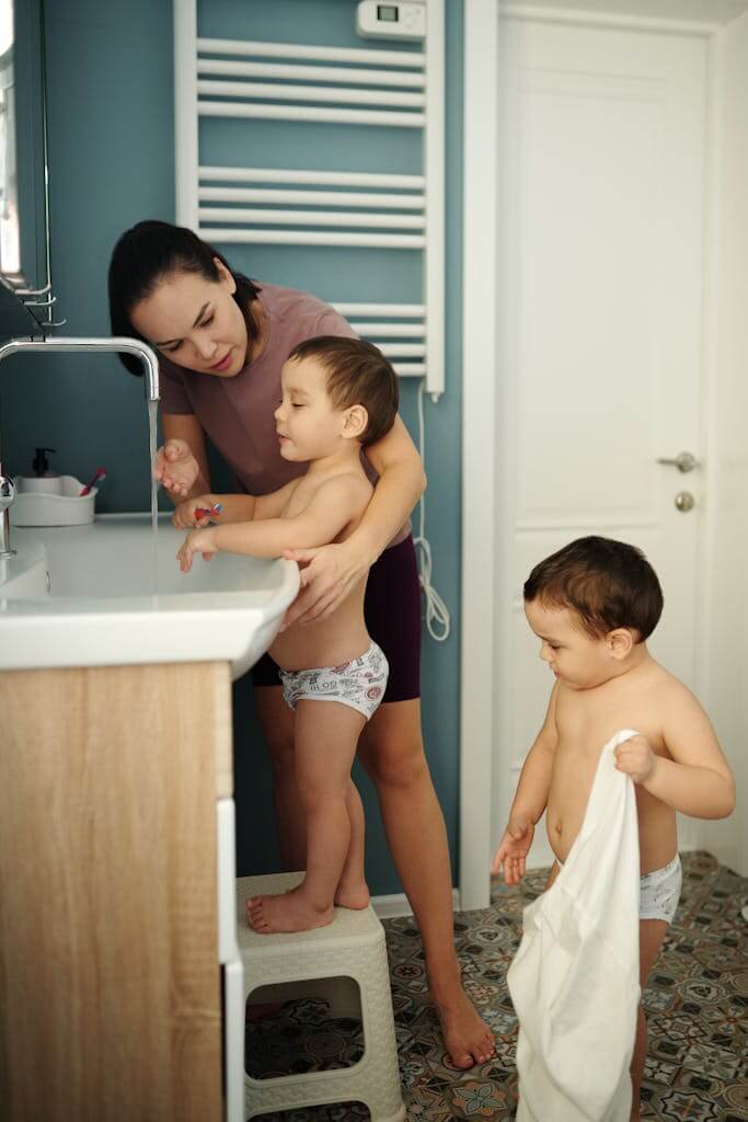 Mom helping sons. A to do list seems like it's never ending as a mom with kids. Therapy for Overwhelmed Moms can help with managing the feelings of overwhelm and determining if there's something more like ADHD. If you're in South Carolina or in North Carolina, Online Therapy for Overwhelmed Moms can help you feel like you again.