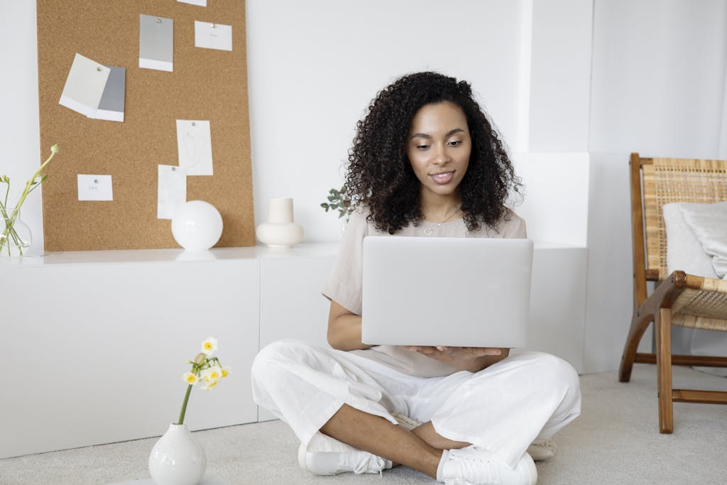 Woman setting up for virtual therapy, Cary NC | Online Brainspotting session NC | Brainspotting for anxiety Charlotte NC | Telehealth trauma support SC | 27519 | 28211 | 27523 | Woman prepares for a virtual brainspotting session from her home in Cary, NC. Experience trauma-informed therapy from anywhere. Book your online session today.