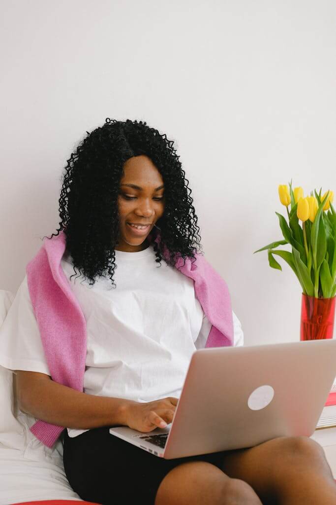 Woman attending a virtual therapy session from her home in Raleigh NC with online therapist Eleena Hardzinski | Therapy for trauma | PTSD | Grief therapist
