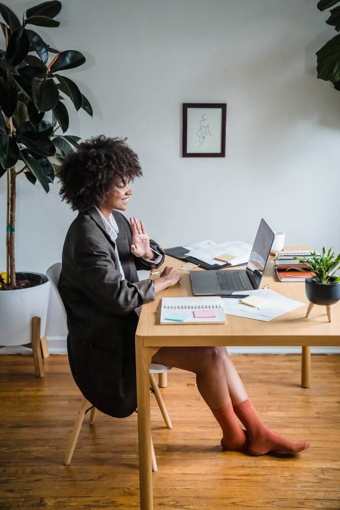 Woman working on laptop during a virtual therapy session from her Charlotte NC home