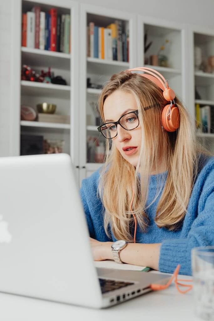 Woman wearing headphones during an online Brainspotting therapy session from home in Charlotte NC