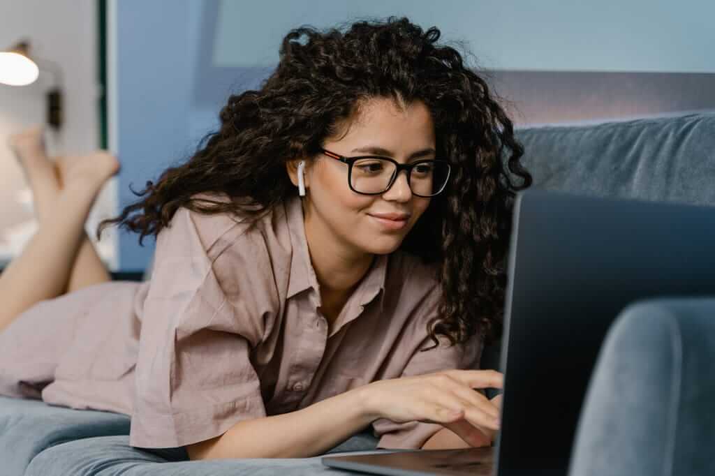 Woman wearing headphones during an online Brainspotting therapy session from her home in Greenville NC | Trauma Therapy | Therapy for Anxiety 